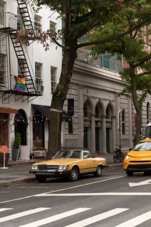Photo for NEW YORK, USA - OCTOBER 11, 2022: Retro car on urban street near buildings - Royalty Free Image