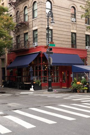 Cafe on corner of modern building on street in New York City