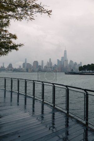 View of World Trade Center in and Hudson river during rainy weather in New York City
