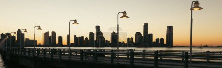 Lanterns on bridge and Hudson river in New York City, banner 