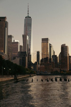Skyscraper and buildings of World Trade Center during sunset in New York City