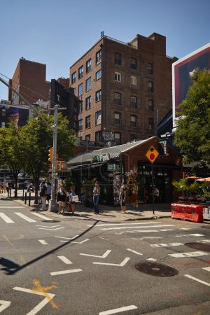 Photo for NEW YORK, USA - NOVEMBER 26, 2022: pedestrians waiting on crosswalk near traffic light, urban scene - Royalty Free Image