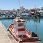 Les Sables d Olonne, France - July 10, 2022: Town fishing port and its fishing boats on a summer day