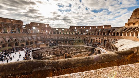 Photo for Rome, Italy - December 27, 2023: interior view of the Coliseum of Rome visited by tourists in the historic city center on a winter day - Royalty Free Image