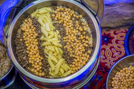 Photo for Ramadan Oriental Egyptian food photography, Koshary, eat in breakfast or lunch or dinner. Photo is selective focus with shallow depth of field. Taken at Cairo Egypt - Royalty Free Image