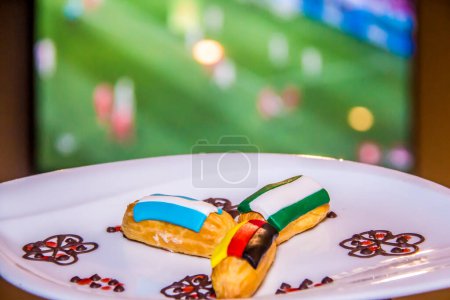 Culture of Faith, Olympic french eclair, World Flags food photography, shot is selective focus with shallow depth of field, taken at lemeridien hotel, Cairo Egypt