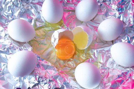 Photo for White fresh egg with colorful ultraviolet holographic neon lights. Creative concept. - Royalty Free Image