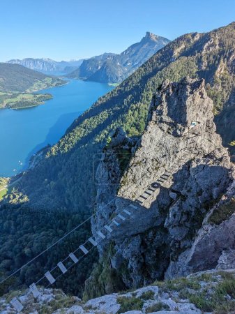 Drachenwand Klettersteig with suspension bridge and beautiful panorama view on Mondsee lake,Austria,Europe, via ferratas and panoramas seen from climbing the road