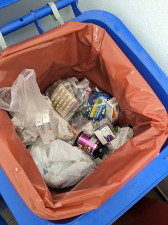 Photo for Prague,Czech republic  October 24 2023 : Wasting with drugs sometimes unopened packs are thrown away to Pharmacy special garbage bin.Unused medicine cost huge amount of money from Health care systems - Royalty Free Image