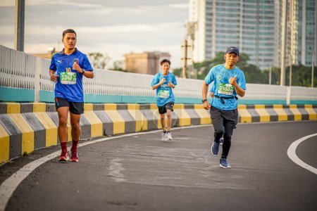 Photo for People running in a marathon event called Superball 2022 in South Jakarta, Indonesia - Royalty Free Image