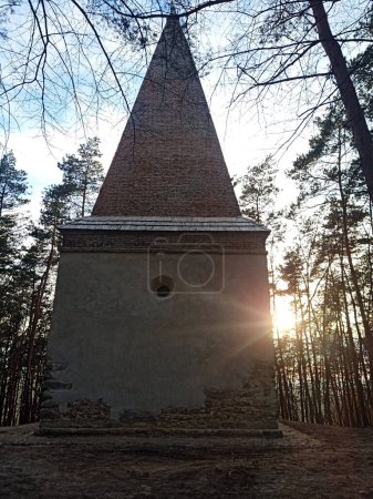 Photo for Arians tower (post renovation)  known also as Grobisko, XVII century pyramidal tower- tomb of Pawe Orzechowski lord of Krupe castle. Spring sunset march 2023 - Royalty Free Image