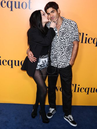 Photo for American video blogger, model and actress Amanda Steele and boyfriend/Colombian model Francisco Escobar arrive at the Veuve Clicquot 250th Anniversary Solaire Culture Exhibition Opening held at 468 North Rodeo Drive on October 25, 2022 in Los Angeles - Royalty Free Image