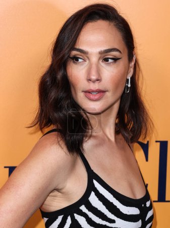 Photo for Israeli actress Gal Gadot (Gal Gadot-Varsano) wearing Michael Kors Collection with a Tyler Ellis bag arrives at the Veuve Clicquot 250th Anniversary Solaire Culture Exhibition Opening held at 468 North Rodeo Drive on October 25, 2022 in LA, USA. - Royalty Free Image