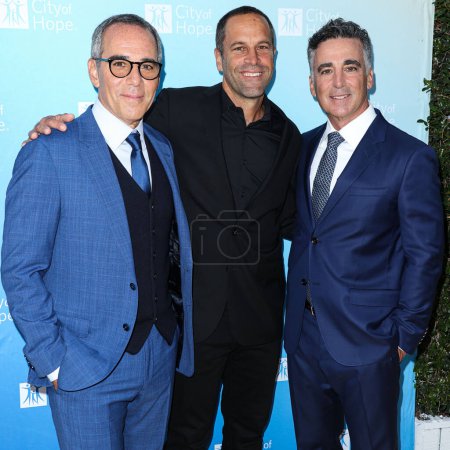 Photo for Co-Founder, Chairman and CEO of Republic Records Monte Lipman, President of Universal Music Publishing Group North America Evan Lamberg and Co-Founder, President and COO of Republic Records Avery Lipman arrive at the City Of Hope's 2022 - Royalty Free Image