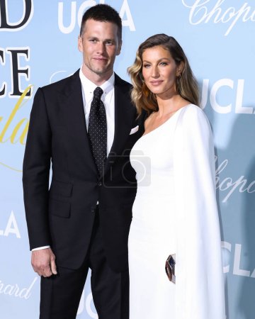 Photo for Tom Brady And Gisele Bundchen To File For Divorce After 13 Years Of Marriage.American football quarterback Tom Brady and wife/ Gisele Bndchen arrive at the UCLA IoES Hollywood For Science Gala  on February 21, 2019 in Los Angeles, California. - Royalty Free Image