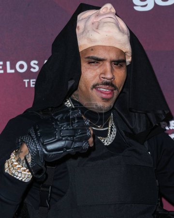 Photo for American singer-songwriter Chris Brown arrives at Darren Dzienciol's CARN*EVIL Halloween Party hosted by Alessandra Ambrosio held at a Private Residence on October 29, 2022 in Bel Air, Los Angeles, California, United States. - Royalty Free Image