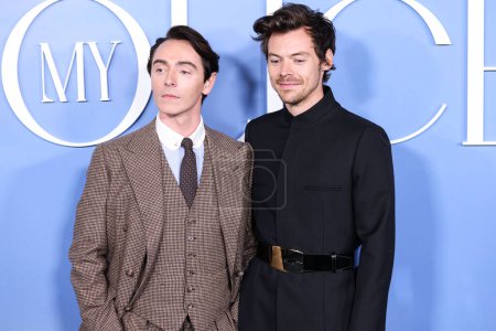Photo for English actor David Dawson and English singer-songwriter Harry Styles wearing a Gucci suit arrive at the Los Angeles Premiere Of Amazon Prime Video's 'My Policeman' held at the Regency Bruin Theatre on November 1, 2022 in Westwood, Los Angeles - Royalty Free Image