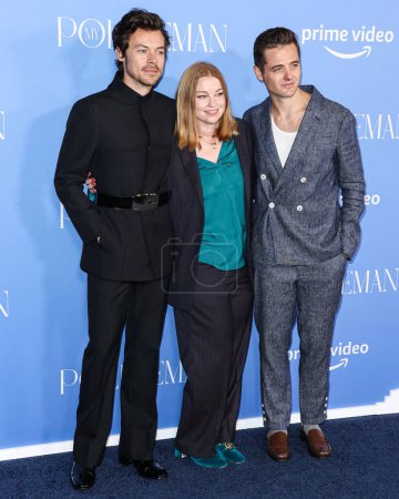 Photo for Harry Styles wearing a Gucci suit, American television and film producer Sarah Schechter and American television producer and former professional soccer player Robbie Rogers arrive at the Los Angeles Premiere on November 1, 2022 - Royalty Free Image