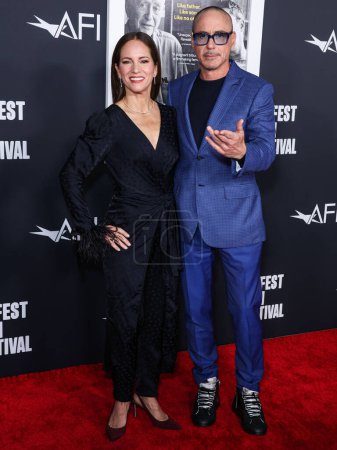 Photo for American film producer Susan Downey and husband/American actor Robert Downey Jr. arrive at the 2022 AFI Fest - Special Screening Of Netflix's 'Sr.' held at the TCL Chinese Theatre IMAX on November 4, 2022 in Hollywood, Los Angeles, California, USA - Royalty Free Image