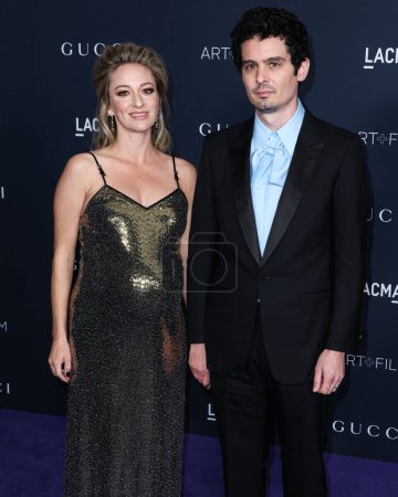 Photo for Olivia Hamilton and husband Damien Chazelle arrive at the 11th Annual LACMA Art + Film Gala 2022 presented by Gucci held at the Los Angeles County Museum of Art on November 5, 2022 in Los Angeles, California, United States. - Royalty Free Image