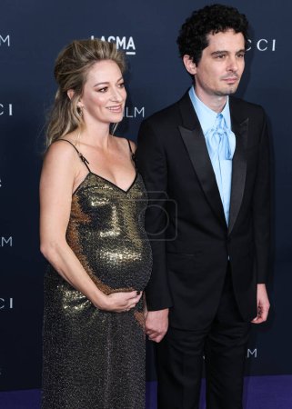 Photo for Olivia Hamilton and husband Damien Chazelle arrive at the 11th Annual LACMA Art + Film Gala 2022 presented by Gucci held at the Los Angeles County Museum of Art on November 5, 2022 in Los Angeles, California, United States. - Royalty Free Image