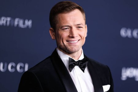 Photo for Taron Egerton arrives at the 11th Annual LACMA Art + Film Gala 2022 presented by Gucci held at the Los Angeles County Museum of Art on November 5, 2022 in Los Angeles, California, United States. - Royalty Free Image