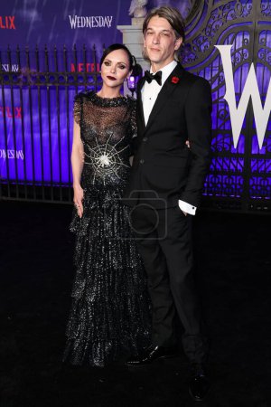 Photo for American actress Christina Ricci wearing Rodarte and husband/hair stylist Mark Hampton arrive at the World Premiere Of Netflix's 'Wednesday' Season 1 held at the Hollywood American Legion Post 43 at Hollywood Legion Theater on November 16, 2022 - Royalty Free Image