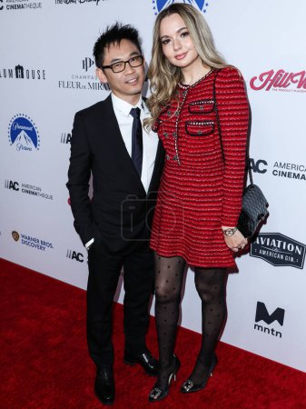 Photo for Australian director James Wan and partner/Romanian actress Ingrid Bisu arrive at the 36th Annual American Cinematheque Awards Honoring Ryan Reynolds held at The Beverly Hilton Hotel on November 17, 2022 in Beverly Hills, Los Angeles, California - Royalty Free Image