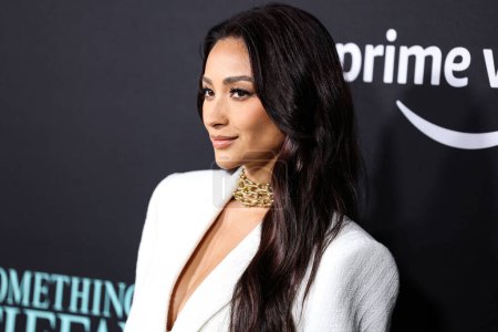Photo for Canadian actress and model Shay Mitchell wearing a The Mannei suit and Tiffany and Co. jewelry arrives at Los Angeles Premiere Of Amazon Prime Video's 'Something From Tiffany's' held at AMC Century City 15 on November 29, 2022 in LA, CA - Royalty Free Image