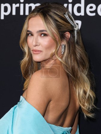 Photo for American actress Zoey Deutch wearing a Tiffany blue Carolina Herrera dress with Tiffany and Co. jewelry arrives at the Los Angeles Premiere Of Amazon Prime Video's 'Something From Tiffany's' held at AMC Century City 15 on November 29, 2022 in LA, CA - Royalty Free Image