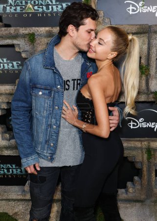 Photo for Gleb Savchenko and Elena Belle arrive at the Disney+ Original Series 'National Treasure: Edge Of History' Season 1 Red Carpet Event held at the El Capitan Theatre on December 5, 2022 in Hollywood, Los Angeles, California, United States. - Royalty Free Image