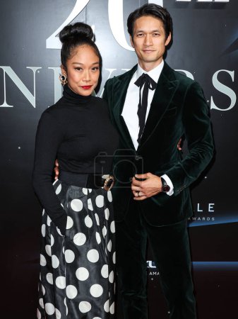 Photo for Shelby Rabara and Harry Shum Jr. arrive at the 20th Annual Unforgettable Gala Asian American Awards presented by Character Media held at The Beverly Hilton Hotel on December 17, 2022 in Beverly Hills, Los Angeles, California, United States. - Royalty Free Image