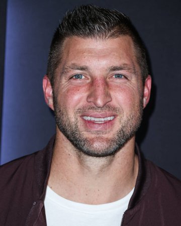 Photo for American football player Tim Tebow arrives at ESPN And CFP's Allstate Party At The Playoff Event 2023 held at The Majestic Downtown on January 7, 2023 in Los Angeles, California, United States. - Royalty Free Image