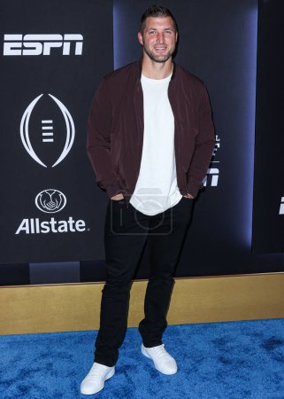 Photo for American football player Tim Tebow arrives at ESPN And CFP's Allstate Party At The Playoff Event 2023 held at The Majestic Downtown on January 7, 2023 in Los Angeles, California, United States. - Royalty Free Image