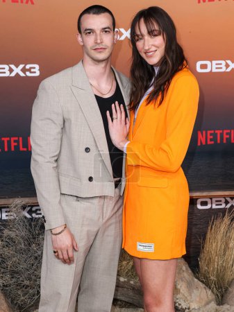 Téléchargez les photos : Bryan Pearn and Ava Michelle arrive at the Los Angeles Premiere Of Netflix's 'Outer Banks' Season 3 held at the Regency Village Theatre on February 16, 2023 in Westwood, Los Angeles, California, United States. - en image libre de droit