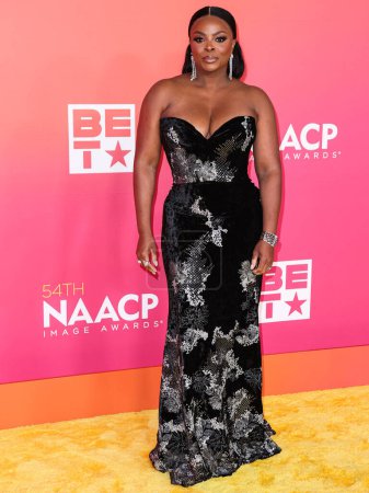 Photo for Janelle James wearing Christian Siriano PF23 arrives at the 54th Annual NAACP Image Awards held at the Pasadena Civic Auditorium on February 25, 2023 in Pasadena, Los Angeles, California, United States. - Royalty Free Image