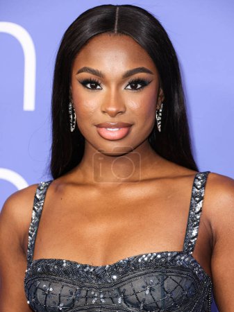 Photo for Coco Jones wearing a Cucculelli Shaheen Collection crop top and pants arrives at the 2023 Billboard Women In Music held at the YouTube Theater on March 1, 2023 in Inglewood, Los Angeles, California, United States. - Royalty Free Image