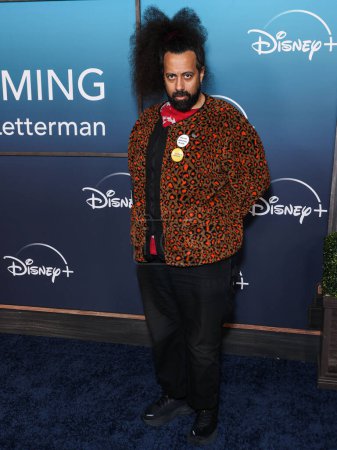 Photo for American comedian, actor, beatboxer and musician Reggie Watts arrives at the Los Angeles Premiere Of Disney+'s Music Docu-Special 'Bono & The Edge: A Sort of Homecoming, With Dave Letterman' held at The Orpheum Theatre on March 8, 2023 in Los Angeles - Royalty Free Image