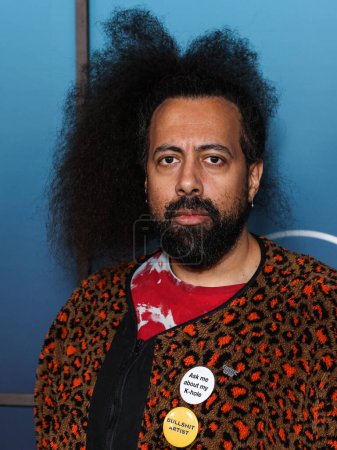 Photo for American comedian, actor, beatboxer and musician Reggie Watts arrives at the Los Angeles Premiere Of Disney+'s Music Docu-Special 'Bono & The Edge: A Sort of Homecoming, With Dave Letterman' held at The Orpheum Theatre on March 8, 2023 in Los Angeles - Royalty Free Image