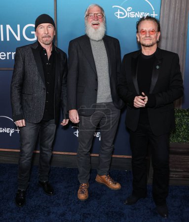 Photo for Irish musician The Edge (David Howell Evans), American television host, comedian and producer Dave Letterman and Irish singer-songwriter, activist and philanthropist Bono (Paul David Hewson) at The Orpheum Theatre on March 8, 2023 in Los Angeles, USA - Royalty Free Image