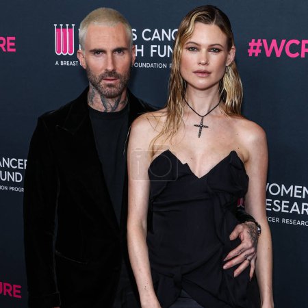 Photo for American singer and songwriter Adam Levine of American pop rock band Maroon 5 and wife/Namibian model Behati Prinsloo arrive at The Women's Cancer Research Fund's An Unforgettable Evening Benefit Gala 2023 held at the Beverly Wilshire, USA - Royalty Free Image