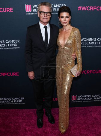 Photo for American actor Harry Hamlin and wife/American actress Lisa Rinna arrive at The Women's Cancer Research Fund's An Unforgettable Evening Benefit Gala 2023 at the Beverly Wilshire, A Four Seasons Hotel on March 16, 2023 in Beverly Hills, LA, CA, USA - Royalty Free Image