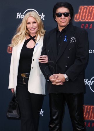 Photo for Shannon Tweed Simmons and husband Gene Simmons arrive at the Los Angeles Premiere Of Lionsgate's 'John Wick: Chapter 4' held at the TCL Chinese Theatre IMAX on March 20, 2023 in Hollywood, Los Angeles, California, United States. - Royalty Free Image
