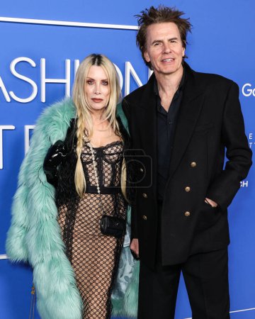 Foto de Gela Nash-Taylor y su esposo John Taylor llegan al Fashion Trust U.S. Premios 2023 celebrados en Goya Studios el 21 de marzo de 2023 en Hollywood, Los Ángeles, California, Estados Unidos. - Imagen libre de derechos
