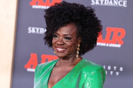 Photo for American actress and producer Viola Davis wearing a Roland Mouret dress and a Judith Leiber bag arrives at the World Premiere Of Amazon Studios' And Skydance Media's 'Air' held at the Regency Village Theatre on March 27, 2023 in Westwood, Los Angeles - Royalty Free Image