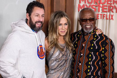 Photo for Adam Sandler, Jennifer Anniston and Dr. John Kani arrive at the Los Angeles Premiere Of Netflix's 'Murder Mystery 2' held at the Regency Village Theatre on March 28, 2023 in Westwood, Los Angeles, California, United States. - Royalty Free Image