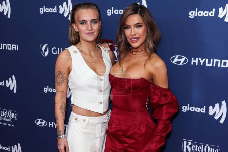 Photo for G Flip and girlfriend Chrishell Stause arrive at the 34th Annual GLAAD Media Awards Los Angeles held at The Beverly Hilton Hotel on March 30, 2023 in Beverly Hills, Los Angeles, California, United States. - Royalty Free Image