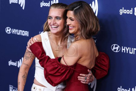 Photo for G Flip and girlfriend Chrishell Stause arrive at the 34th Annual GLAAD Media Awards Los Angeles held at The Beverly Hilton Hotel on March 30, 2023 in Beverly Hills, Los Angeles, California, United States. - Royalty Free Image