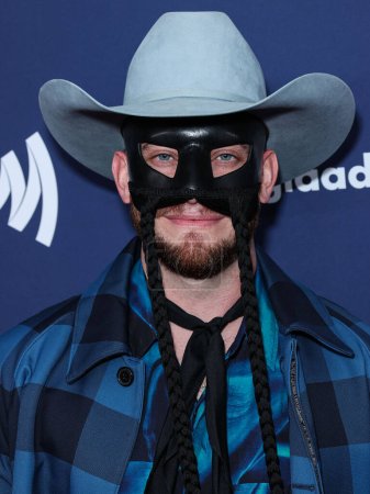Photo for South African country musician Orville Peck arrives at the 34th Annual GLAAD Media Awards Los Angeles held at The Beverly Hilton Hotel on March 30, 2023 in Beverly Hills, Los Angeles, California, United States. - Royalty Free Image