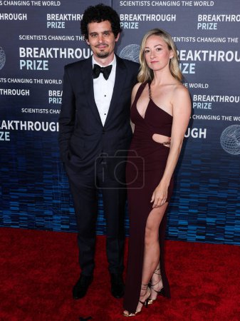 Photo for Damien Chazelle and wife Olivia Hamilton arrive at the 9th Annual Breakthrough Prize Ceremony held at the Academy Museum of Motion Pictures on April 15, 2023 in Los Angeles, California, United States. - Royalty Free Image